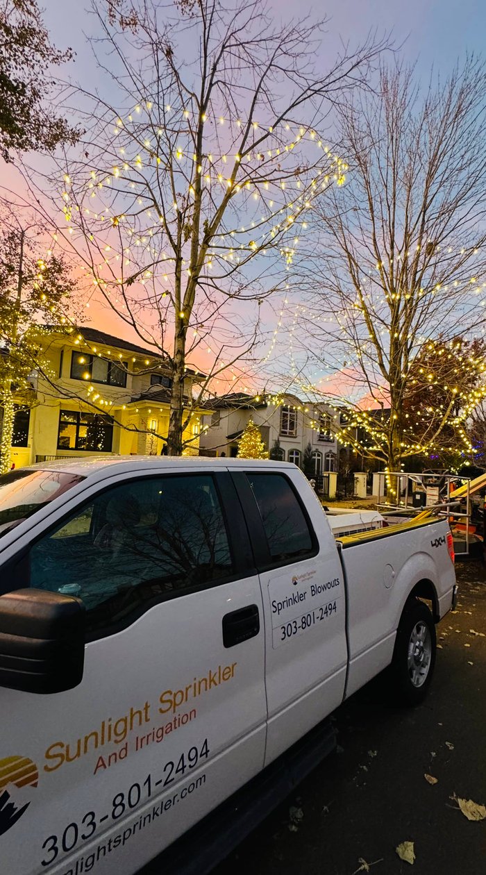 sunlight putting up holiday lighting in denver