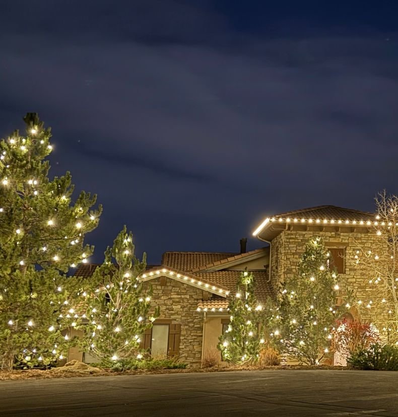 warm white Christmas lights along roofline in Highlands Ranch Colorado