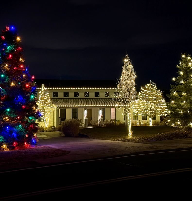 Christmas lighting along gutters and peaks of a Lakewood Colorado home