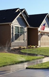 running sprinklers on a beautiful lawn