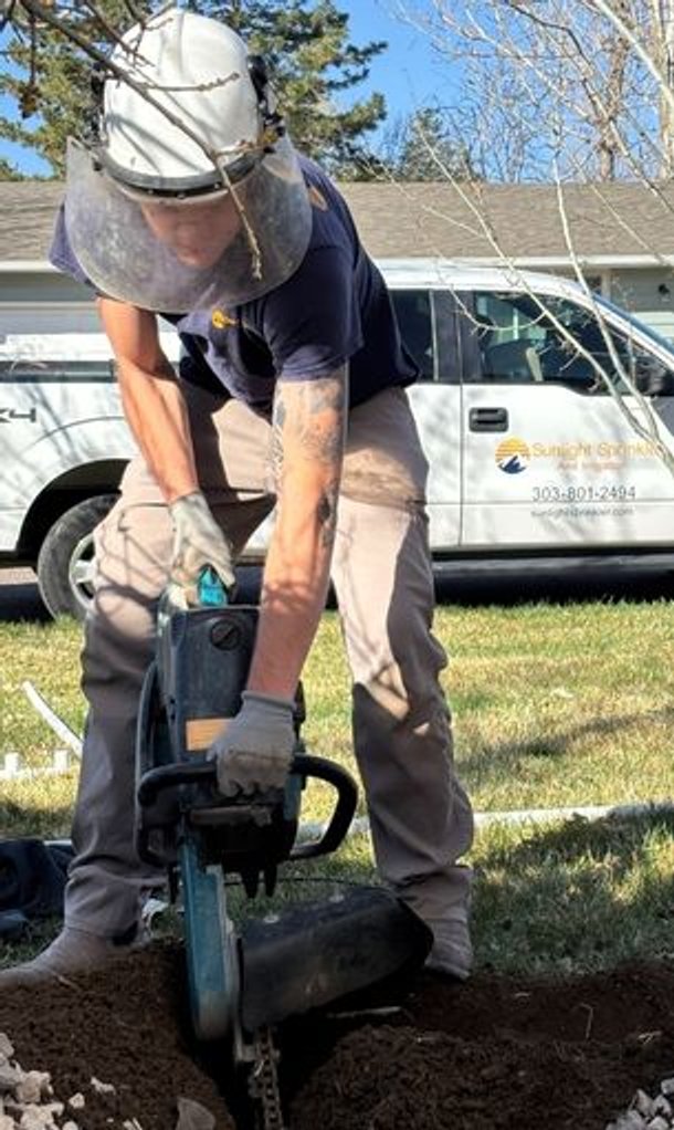 sunlight sprinkler digging an irrigation trench